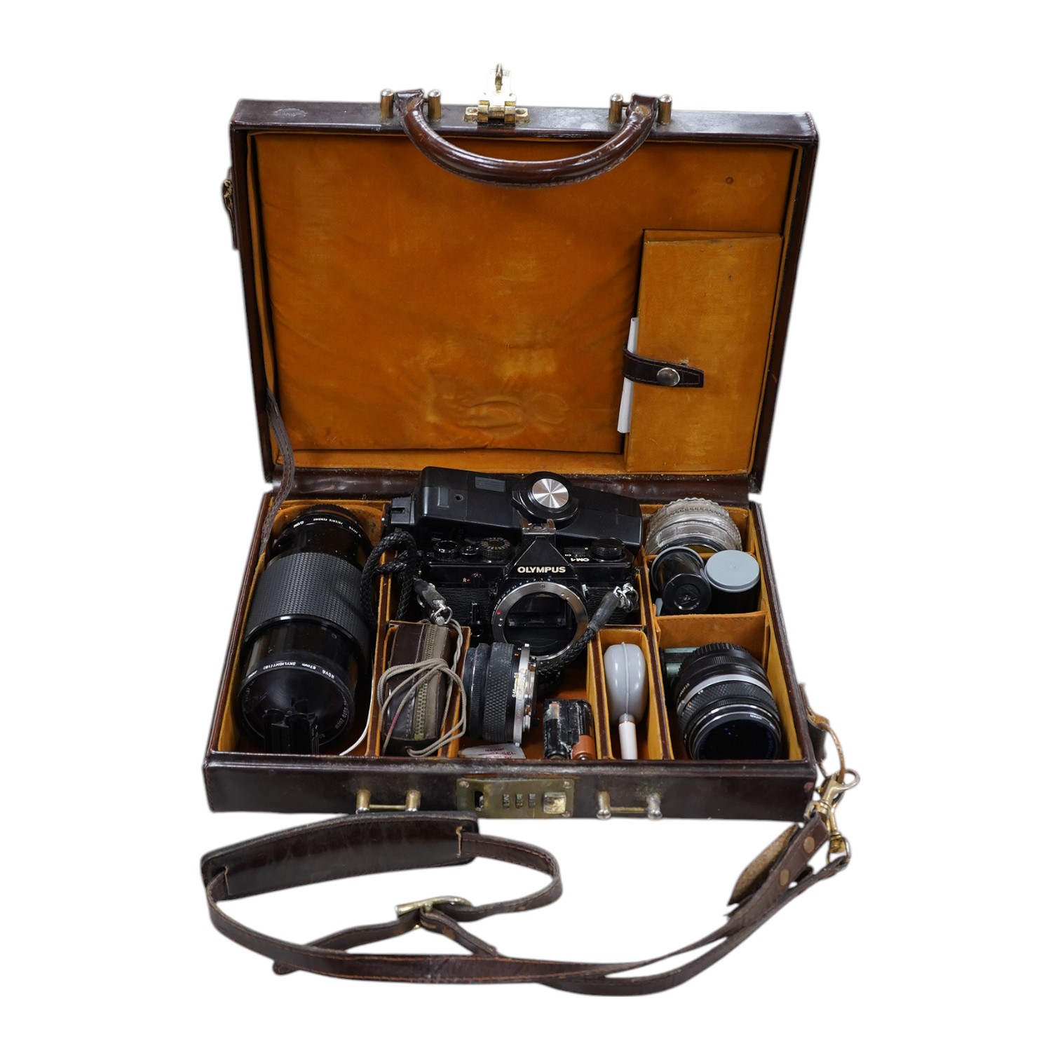 A cased Olympus camera, lenses and equipment, Condition - poor